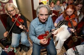 Here’s a picture from Belfast Trad Fest of me in my happy place (playing in a fantastic session led by piper Mick O’Brien and fiddler Sean Smyth).