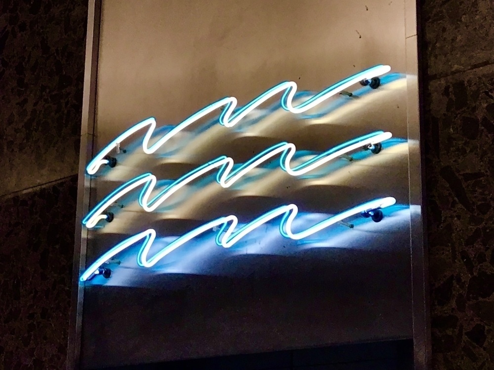 Three lines of squiggly neon. 