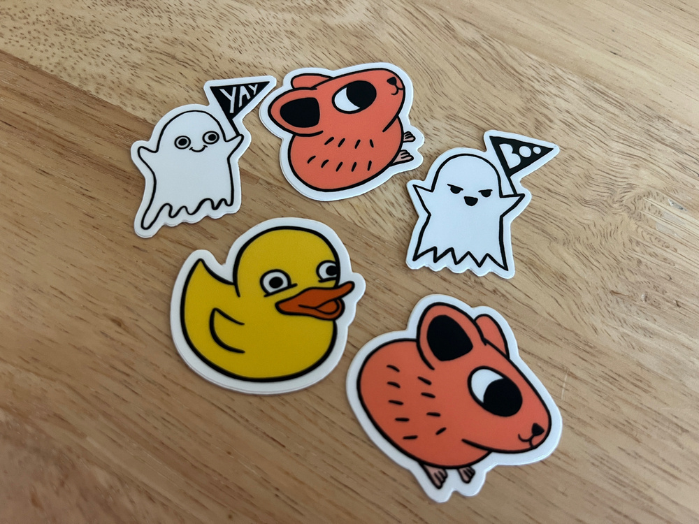 A selection of adorable small decals from Good Enough: a yellow duck, two pikas, a ghost with a yay sign and a ghost with a boo sign