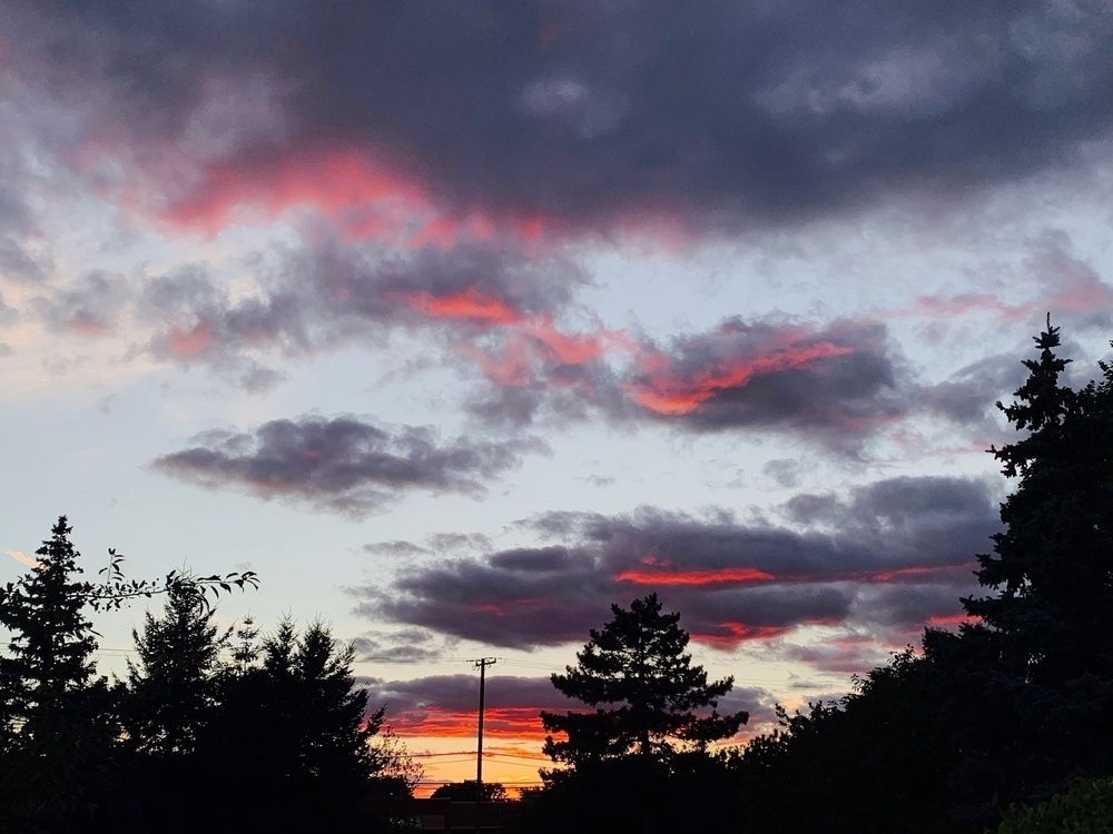 red sunset light highlights clouds