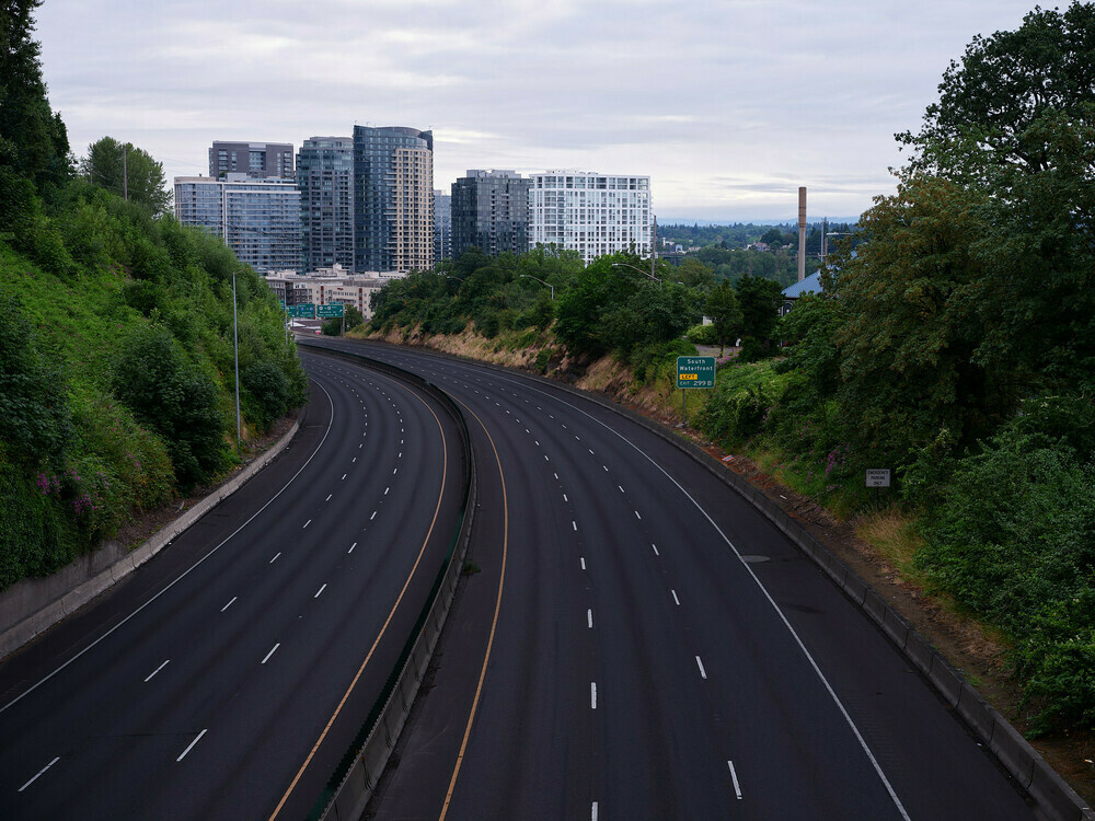 A view above an empty Interstate 5 looking north toward the South Portland neighborhood. No cars are on the usually hectic road.