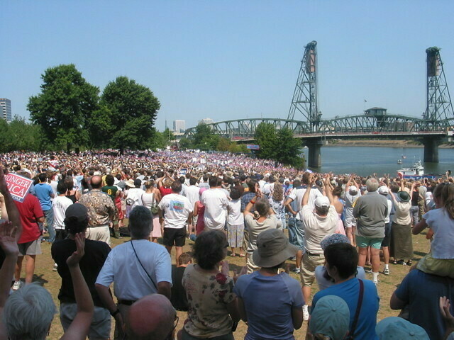 A large crowd of John Kerry supporters is gathered on Portland's waterfront to hear him speak.