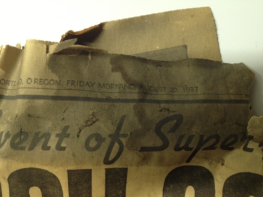 The top corner of an old tattered and stained newspaper with the text: Oregon, Friday Morning, August 20, 1937.