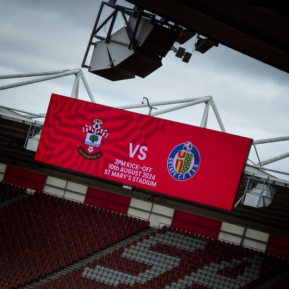 Big screen at St Mary’s Stadium showing Southampton FC and Getafe club crests