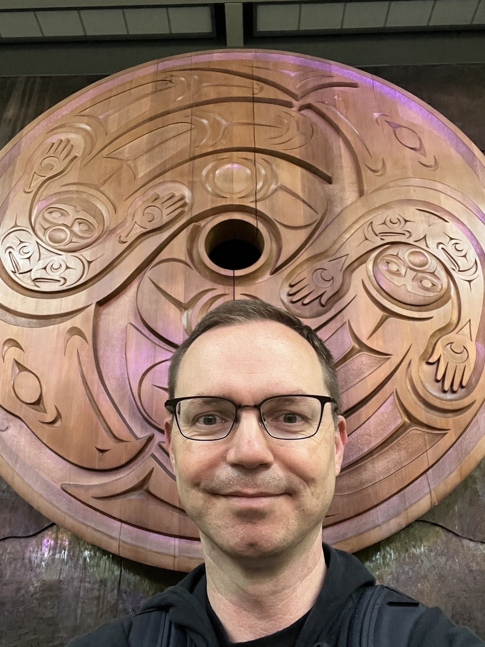 Chad selfie at the welcome carving at YVR immigration