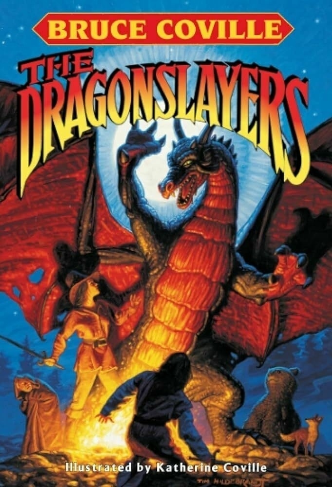 Cover of The Dragonslayers by Bruce Coville. Features two young people who appear to be trying to subdue a fierce dragon that is rearing up. In the background are some forest animals and an elderly person.