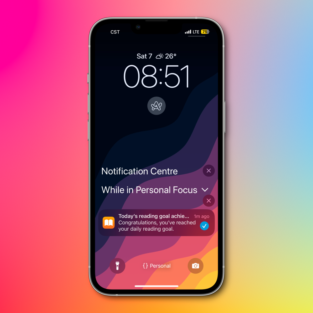 Smartphone lock screen displaying the time as 08:51, date as Saturday 7th, and weather as partly cloudy and 26°C. It shows a notification for reaching a daily reading goal and indicates that the phone is in Personal Focus mode.