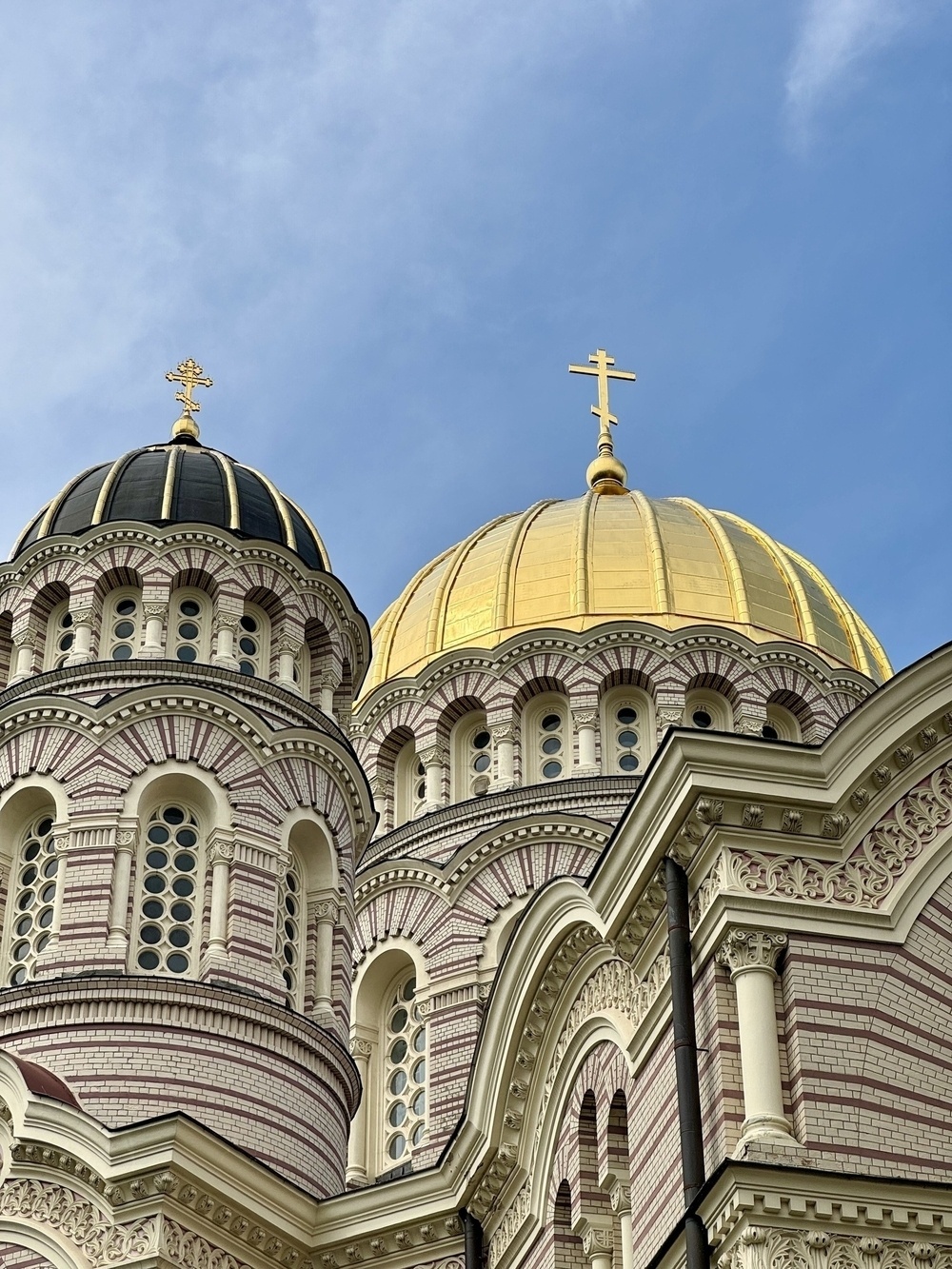 Black and gold domes on the top of a cathedral in Riga.