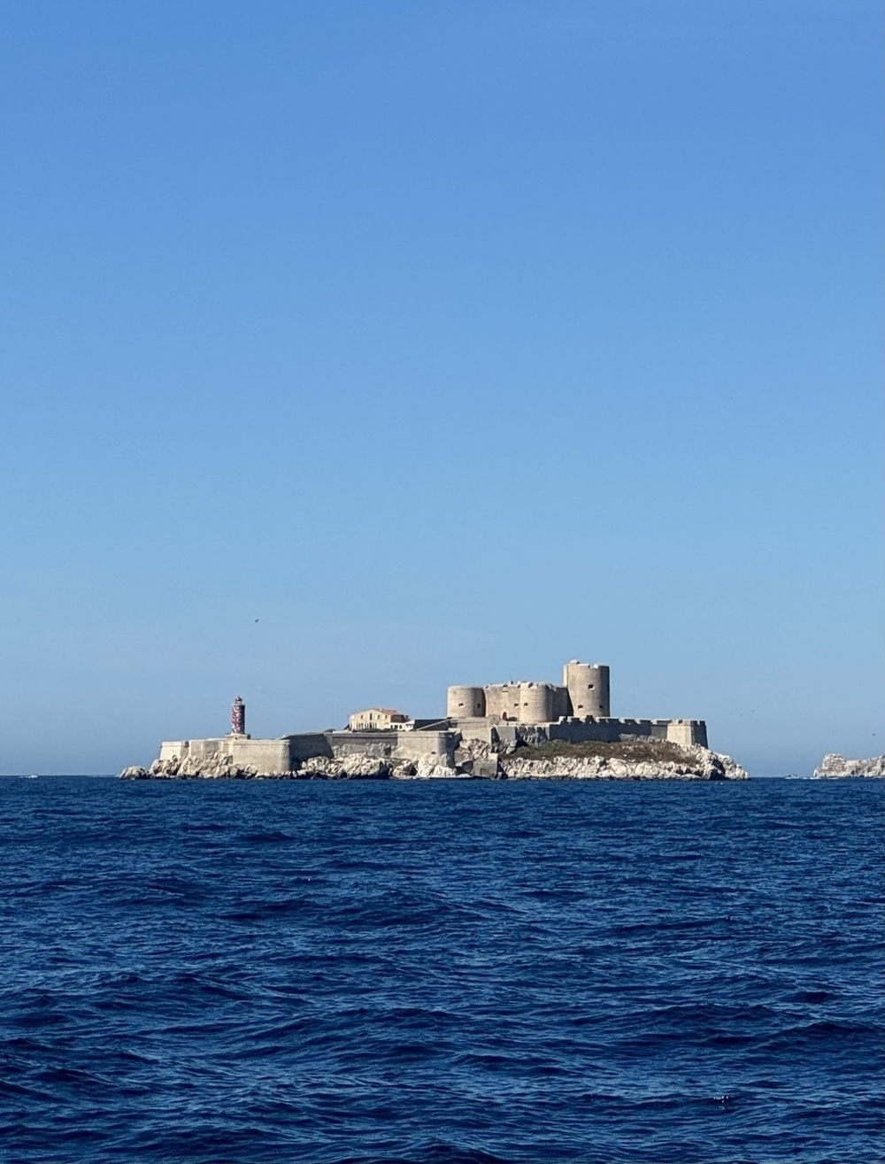 Château d’If on an island across the water.