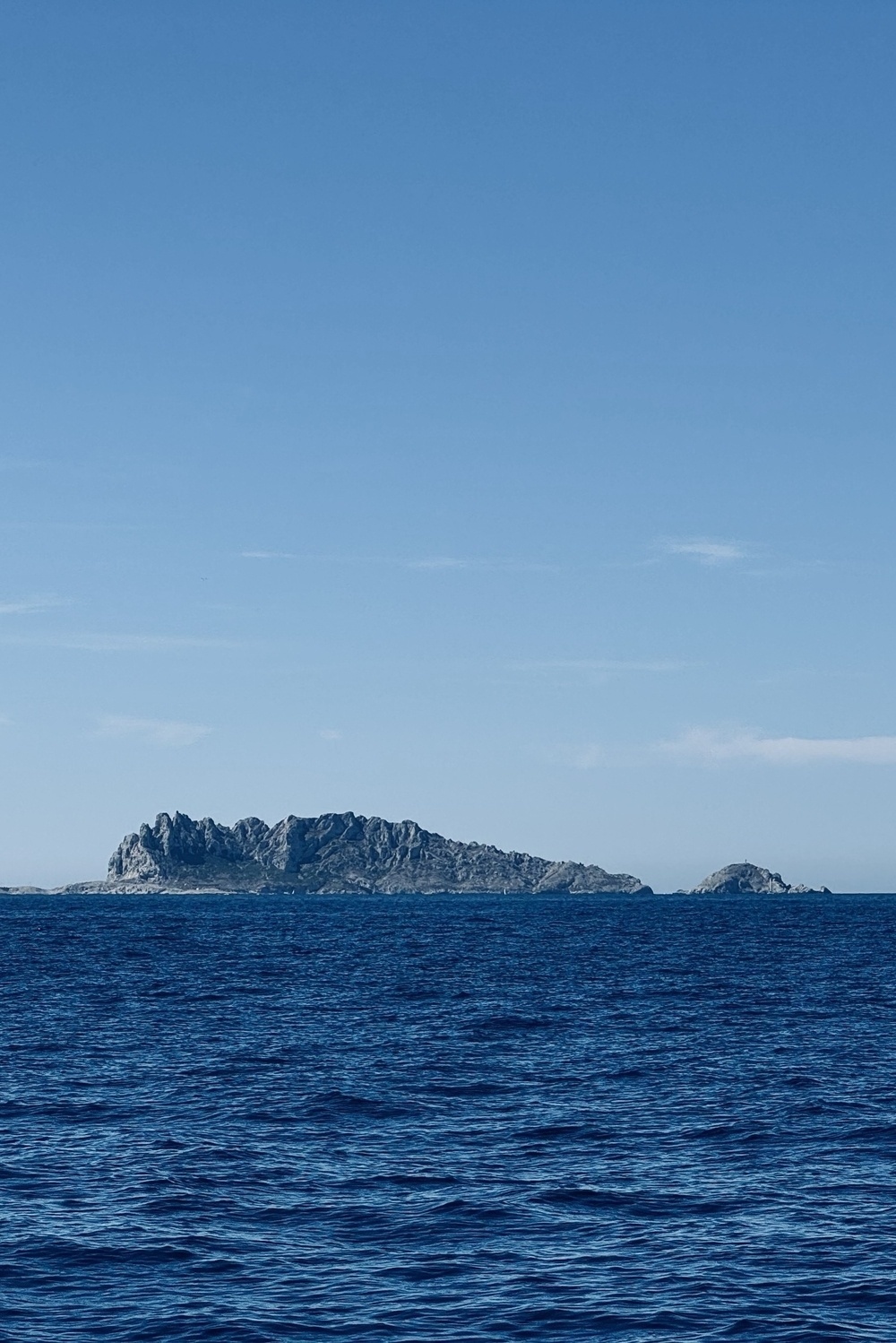 A rocky headland sticking out of the Mediterranean Sea.