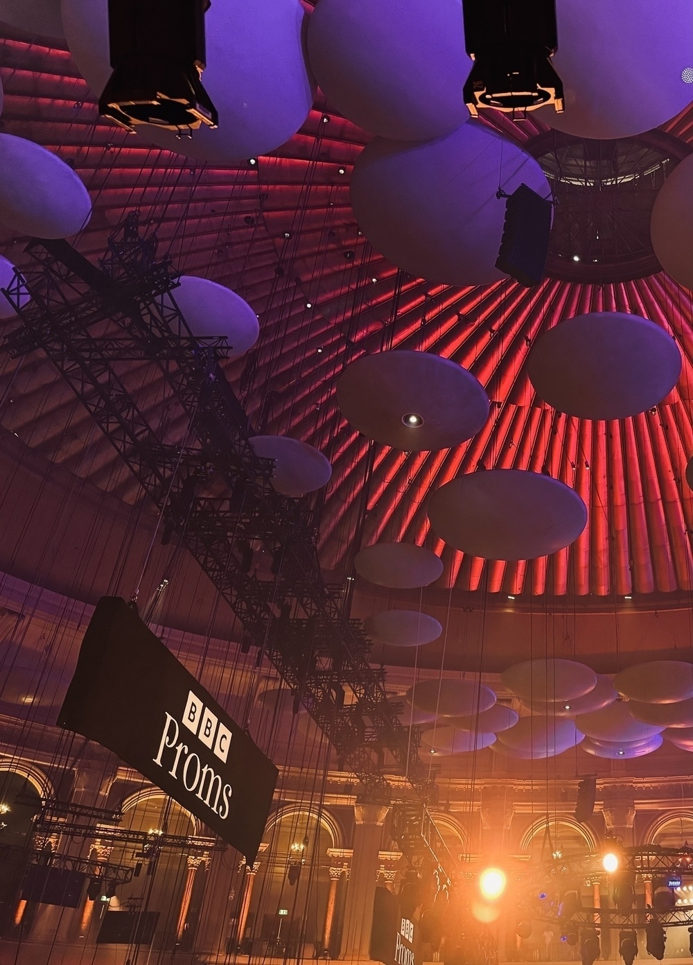 The ceiling of the Royal Albert Hall with a BBC Proms banner hanging from it.
