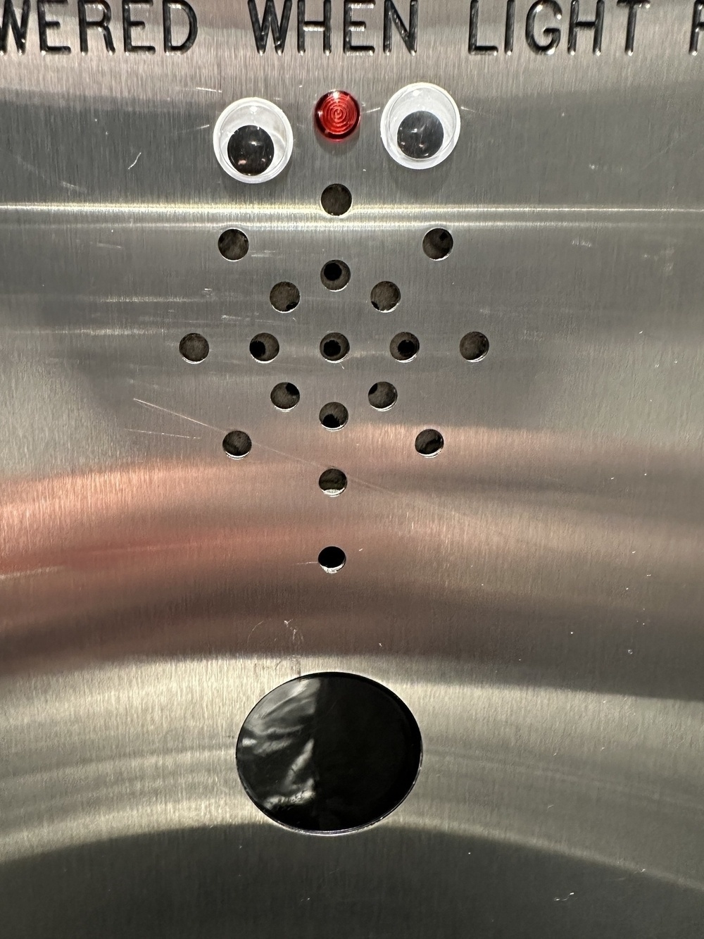Googly eyes added to an elevator.