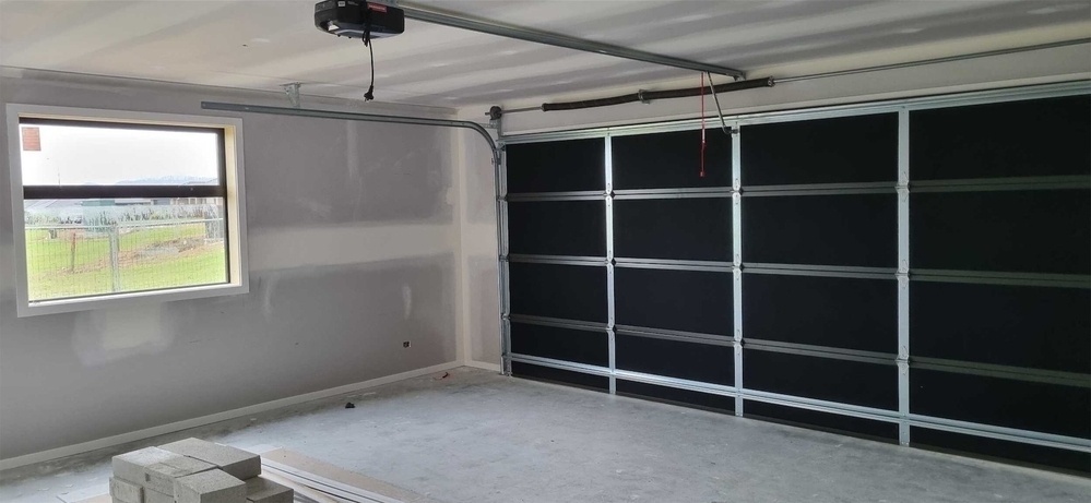 The garage has a door; architraves etc in place.