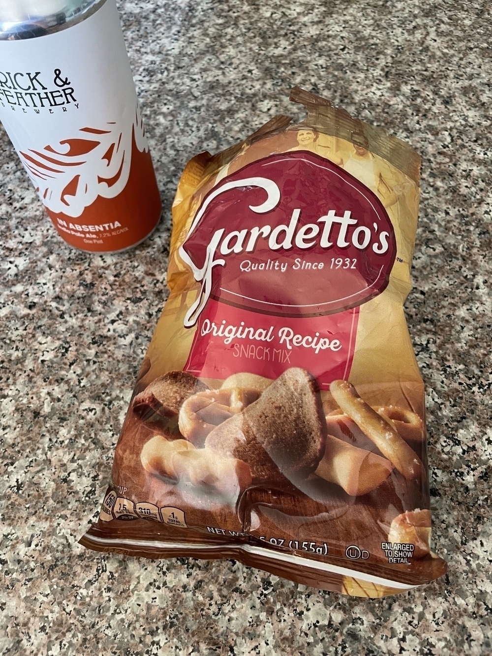 A bag of Gardetto’s snack mix and a beer