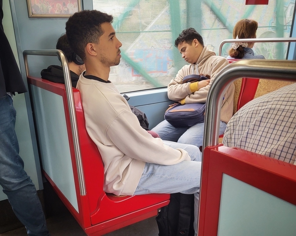 Man sleeping on subway train 