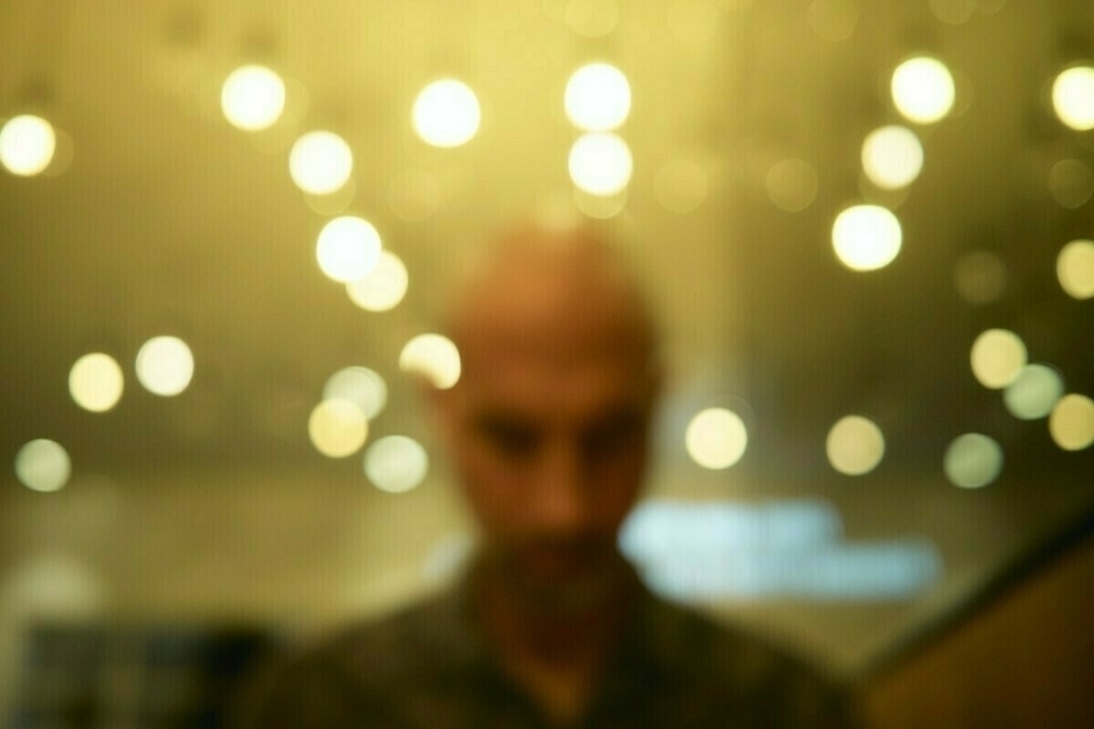 blurry man and lights