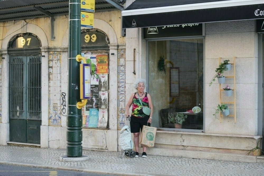 Elderly woman waiting the bus