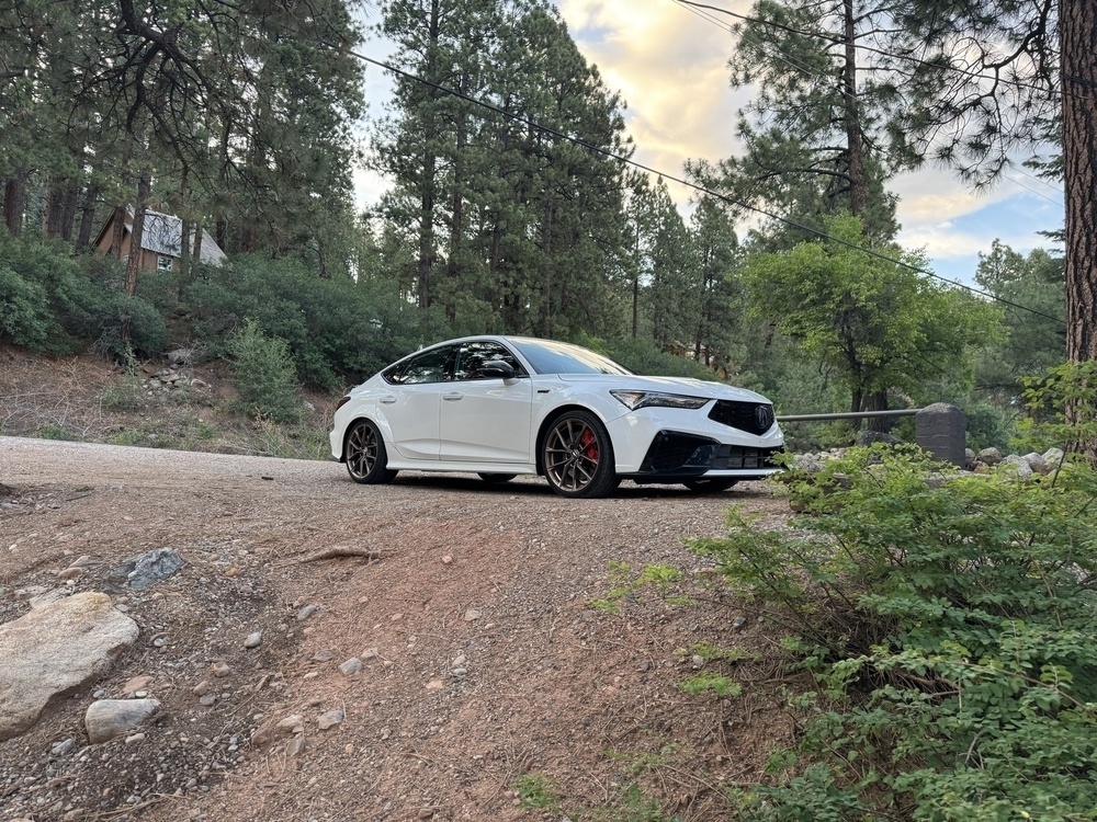 My parked Integra Type S in front of pine trees at the cabin resort. 