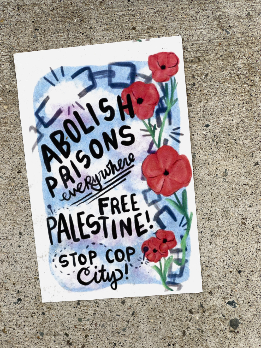 Sticker calling for the abolishment of prisons, the freeing of Palestine and stopping cop city. Decorated with red poppy like flowers.