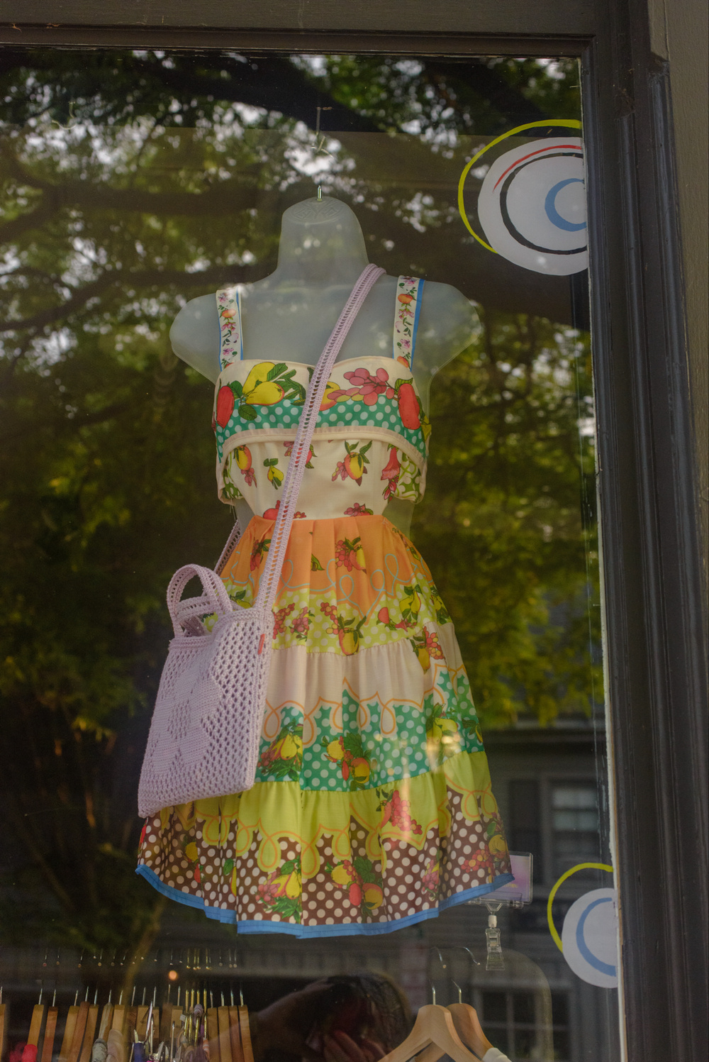 Colorful summer dress in a shop window.