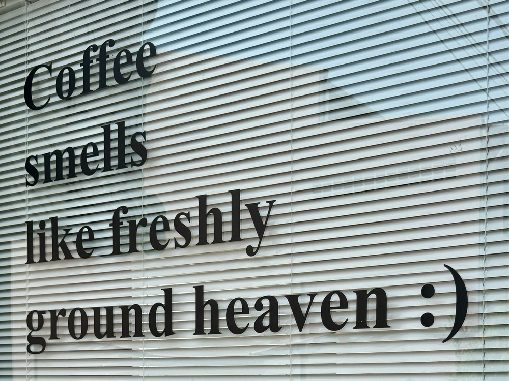 A sign: Coffee smells like freshly ground heaven :)