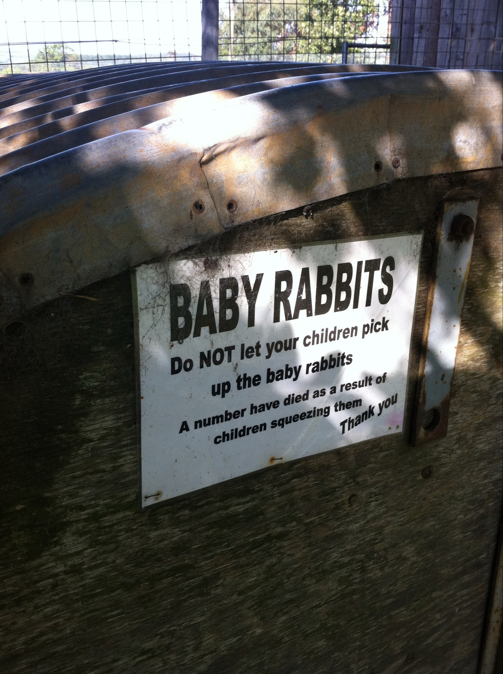 A sign saying do not pick up baby rabbits as a number have died as a result of children squeezing them