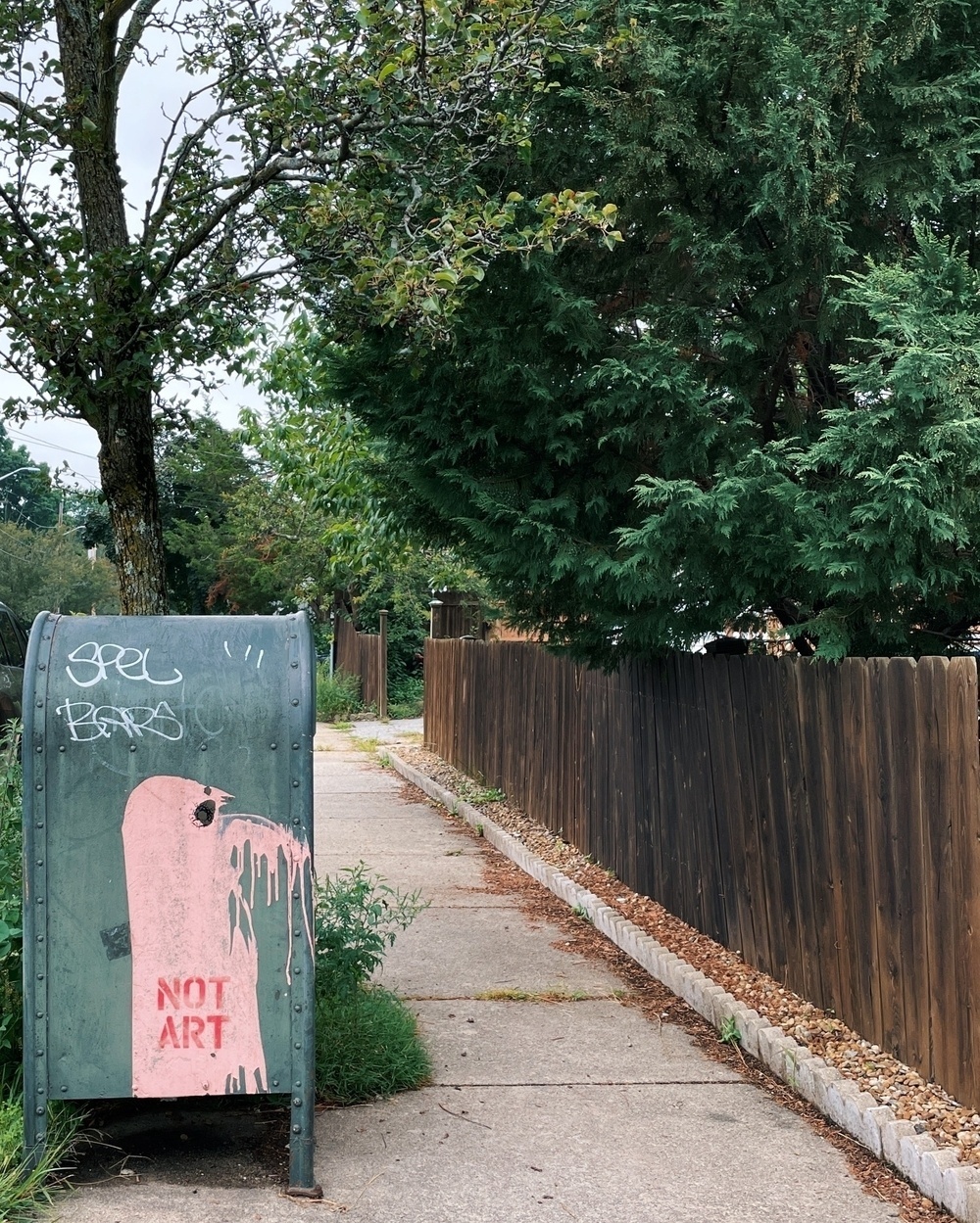 A postbox reading "NOT ART"