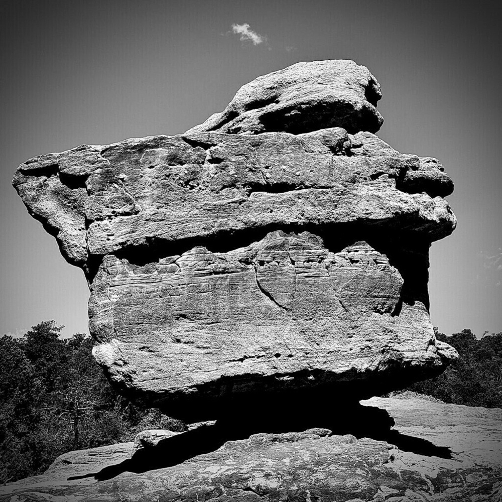 Balanced Rock. Large boulder. Clear sky. Black and White.