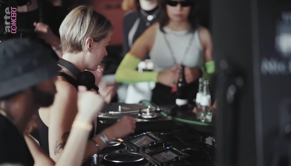 Woman on the decks in a club