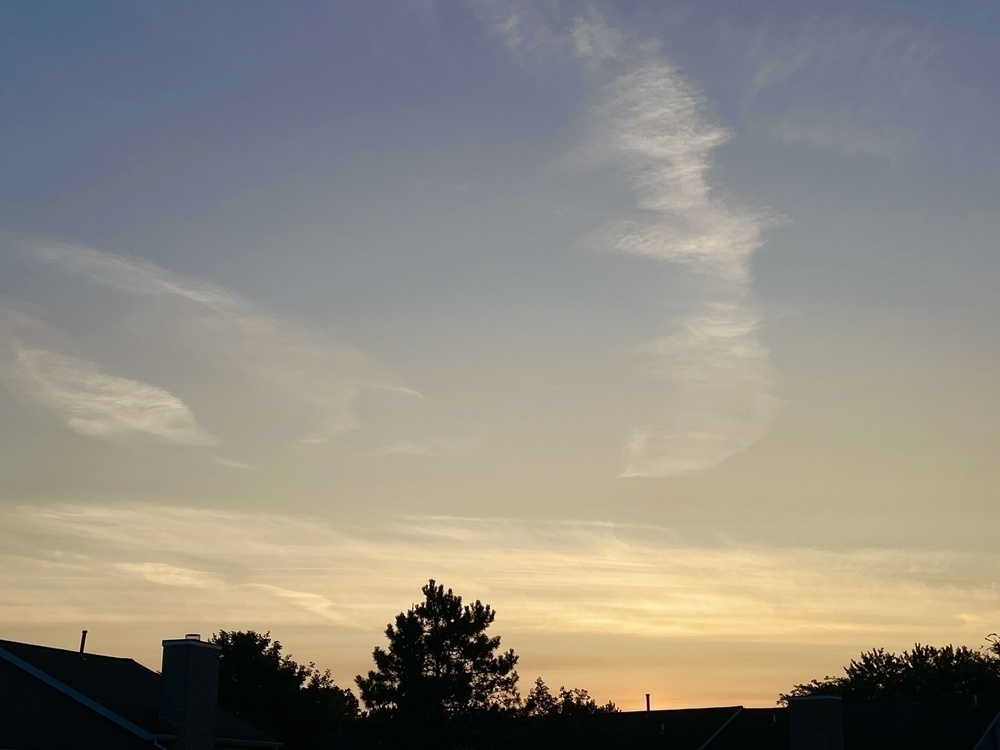 Sunrise colored sky before the sun crests over the foreground