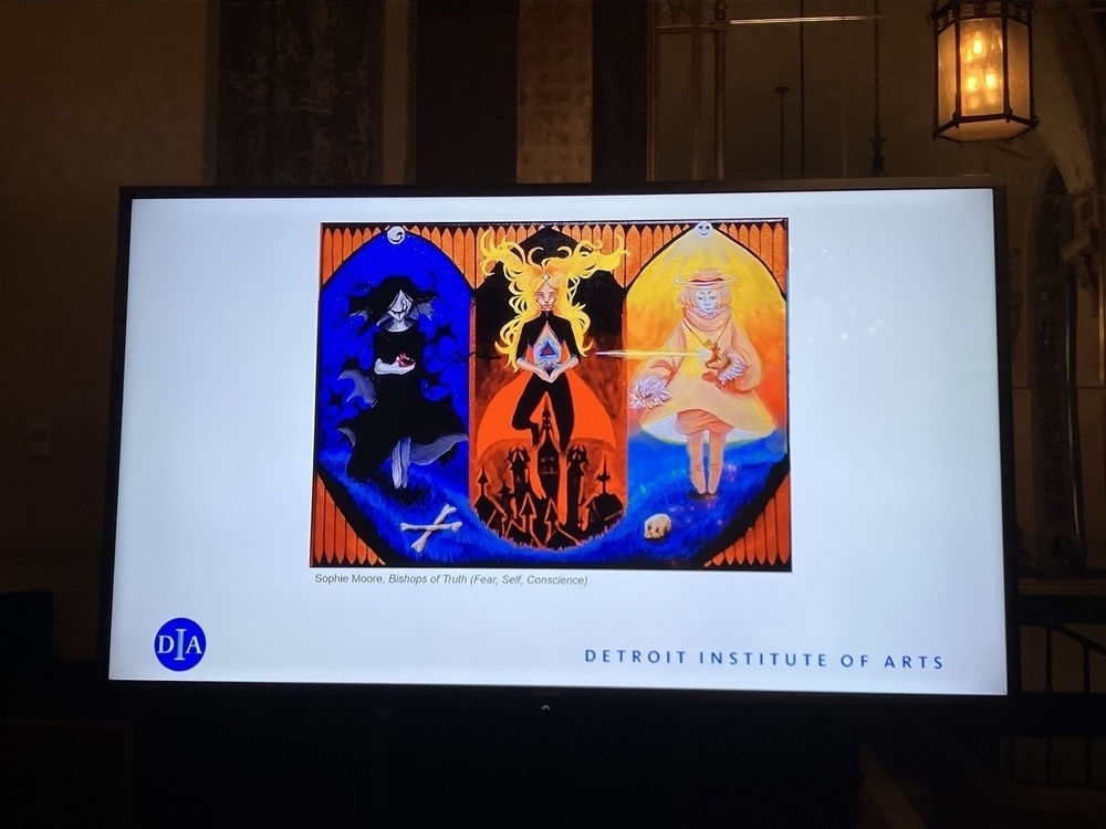 Screen displaying a PowerPoint slide of a triptych painting