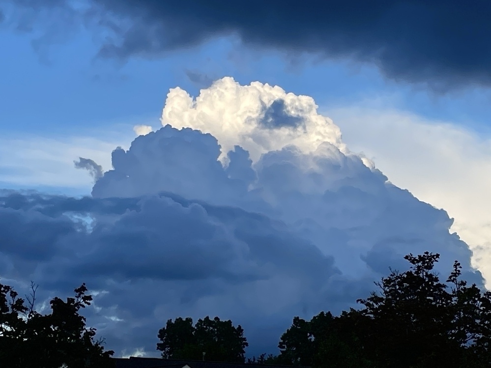 Large clouds accumulated in the shape of a mountain