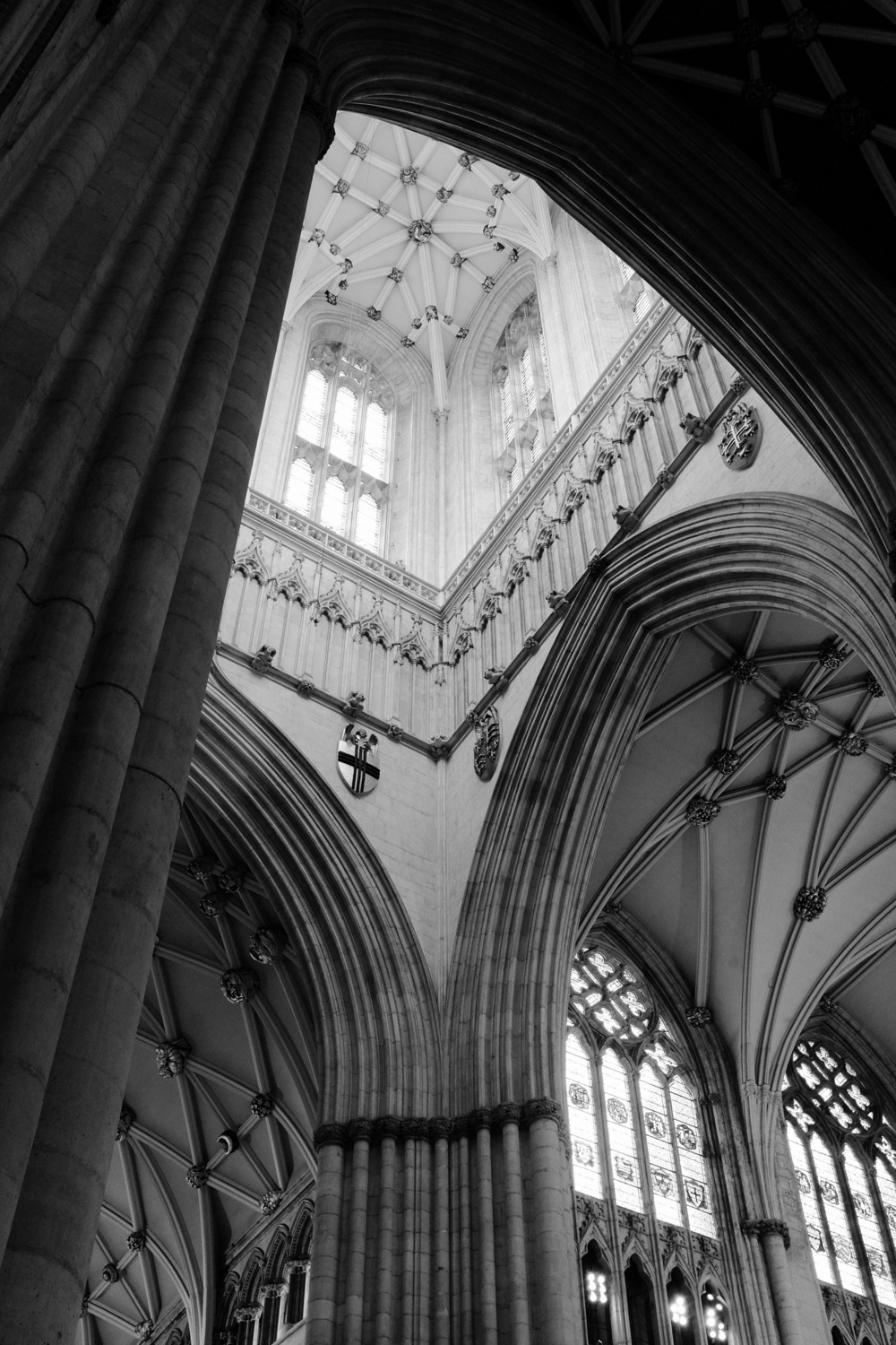 Looking up from beneath the darkness of the Gothic arches, the gaze rests on the light and airy heights of the cathedral.
