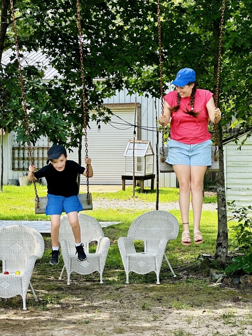 Child and Kalena swinging