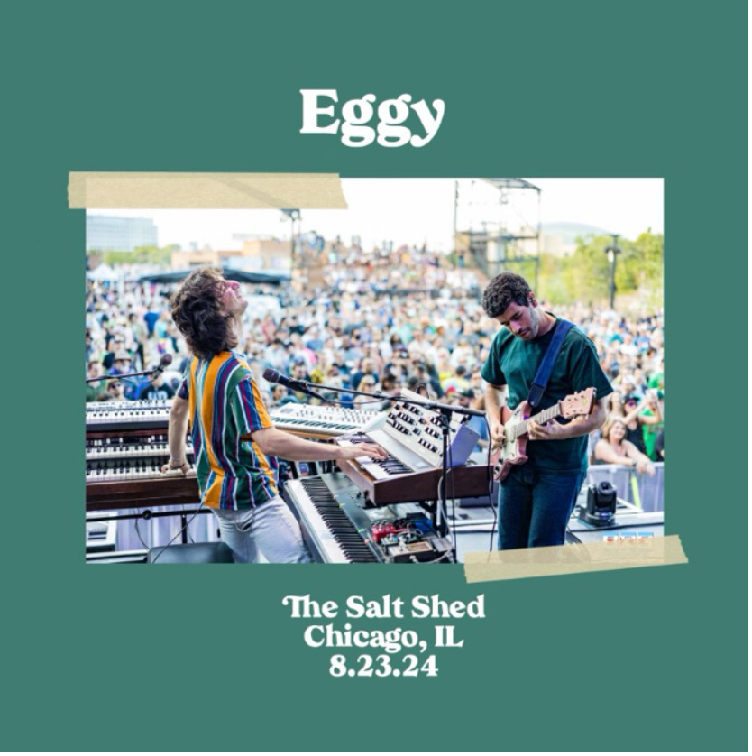 A band performs on stage in front of a large crowd with the text "Eggy", "The Salt Shed Chicago, IL", and "8.23.24" on a green background around the image.