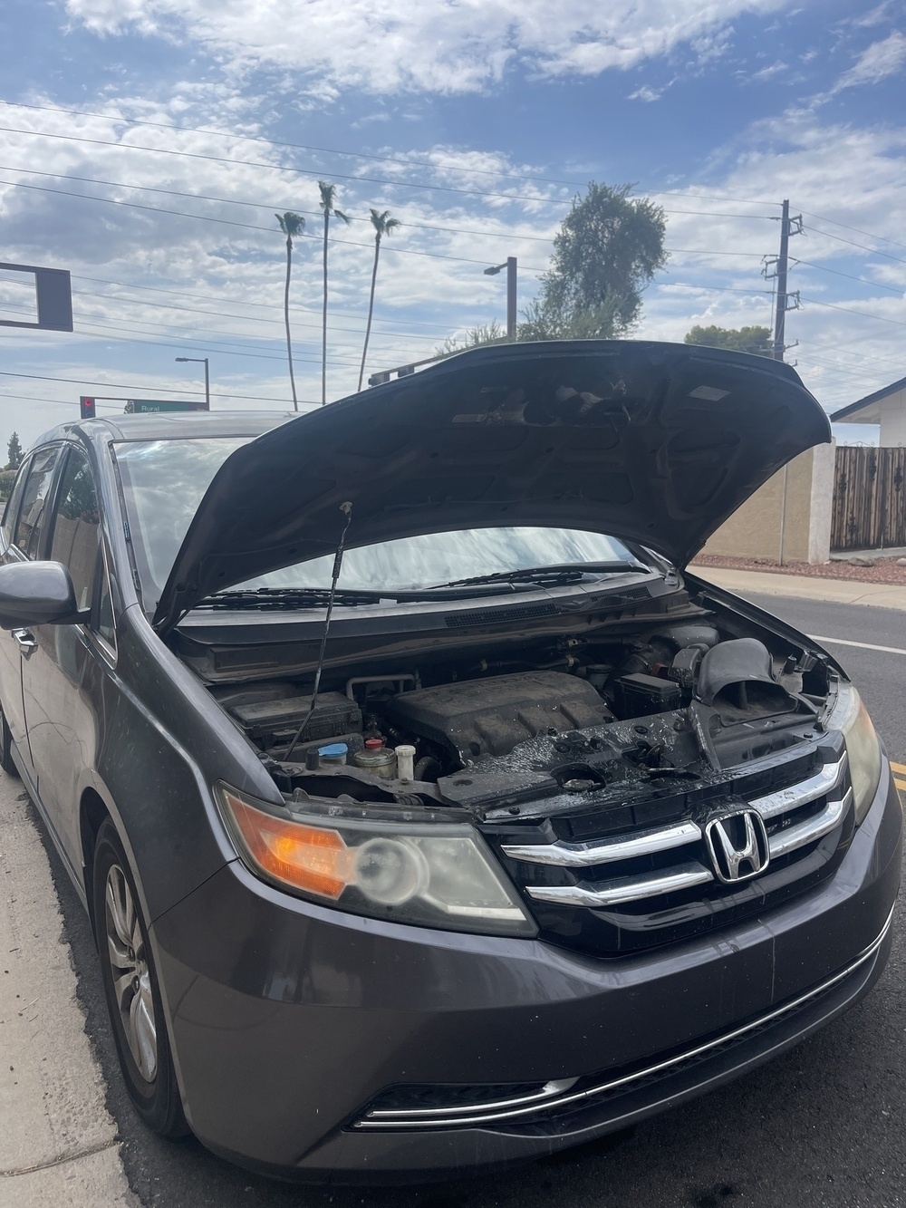 Photo of minivan with a blown radiator