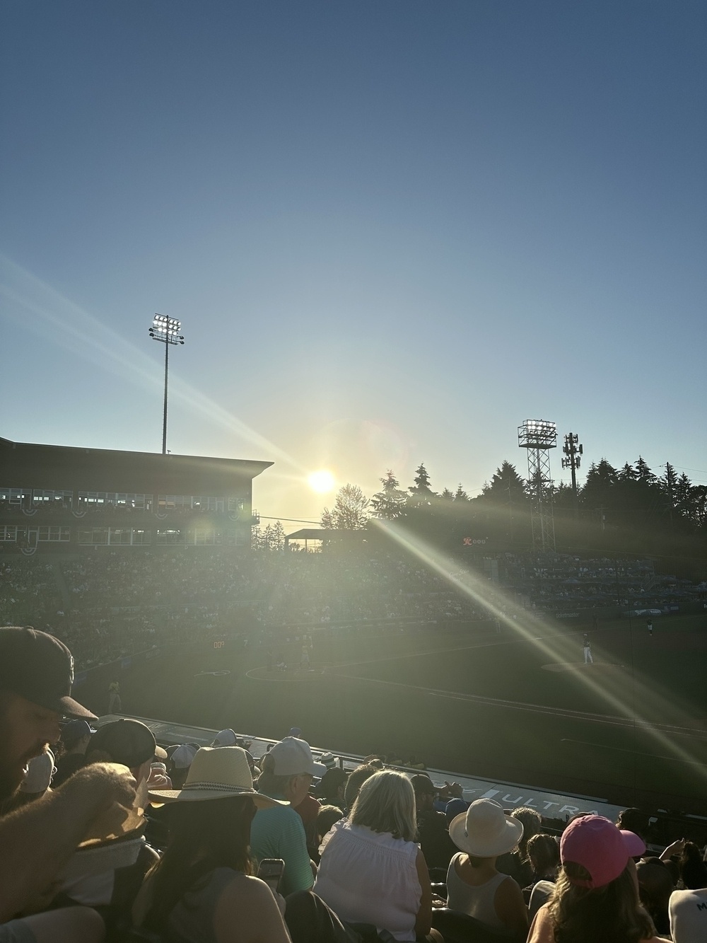 Sunbeams straight into the camera at a baseball stadium &10;