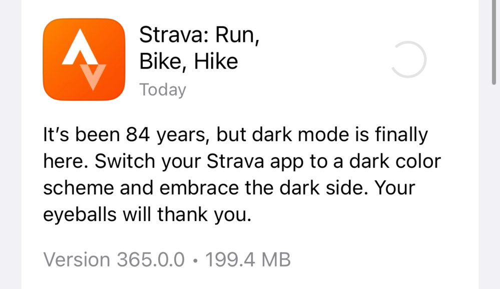 A Strava app update prompt shows an orange icon and describes the new &lsquo;dark mode&rsquo; feature, encouraging users to switch for eye comfort. Text reads: &ldquo;Strava: Run, Bike, Hike Today It&rsquo;s been 84 years, but dark mode is finally here. Switch your Strava app to a dark color scheme and embrace the dark side. Your eyeballs will thank you.