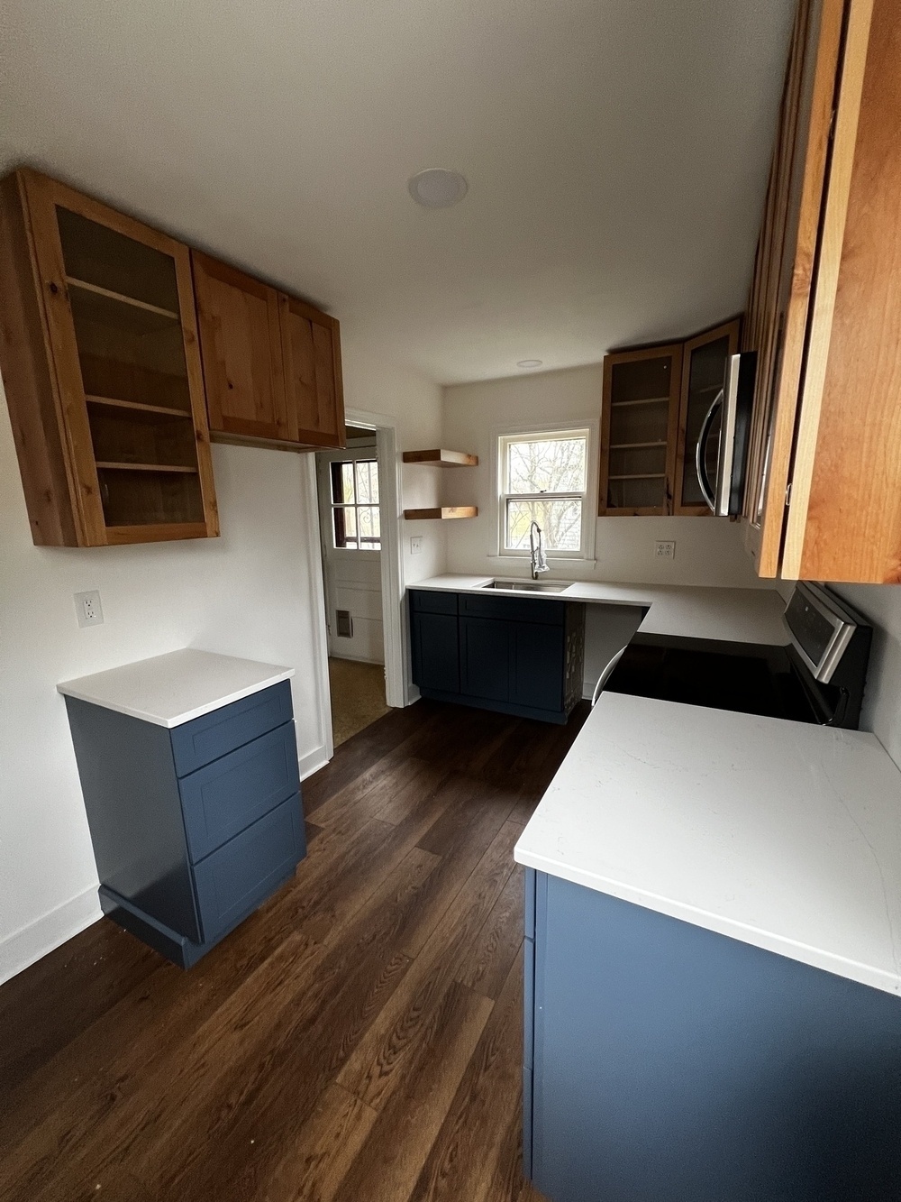 A nearly complete kitchen renovation with quartz countertops.