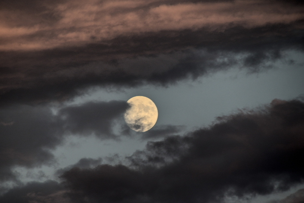 Last week's full moon, between clouds.