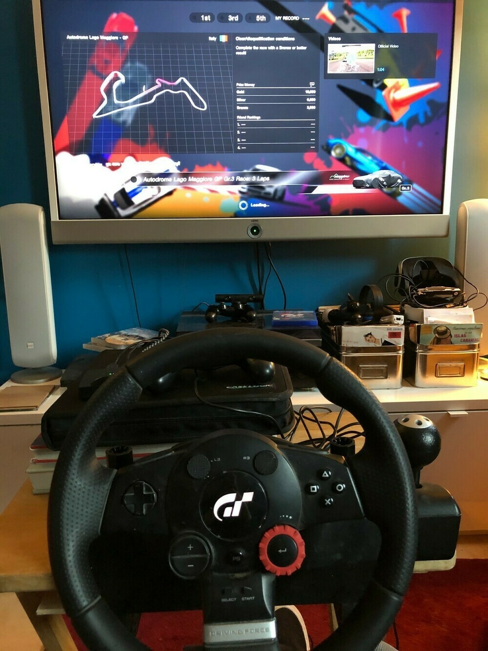 image of GT sport steering wheel with GT Sport game on PS4