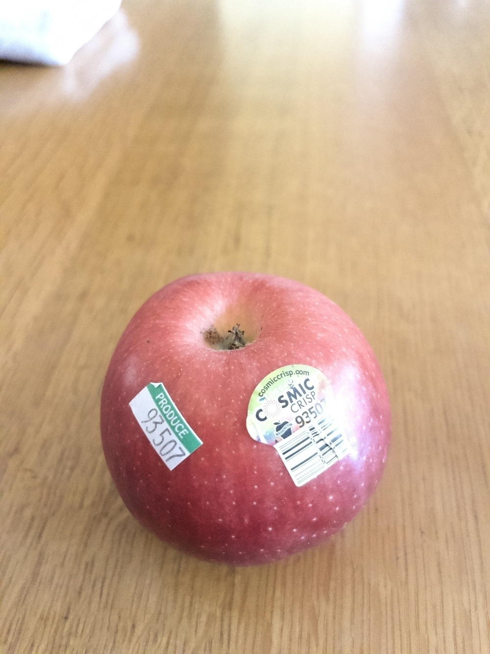 Apple with store stickers.