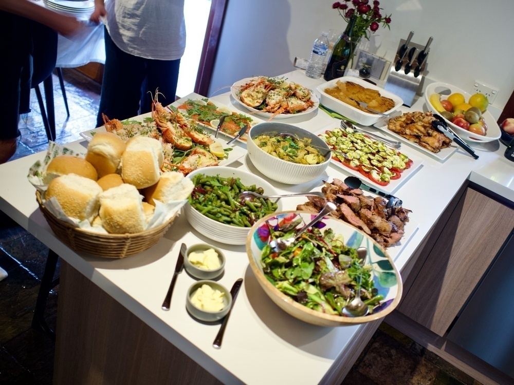 A Christmas lunch spread on a kitchen bench