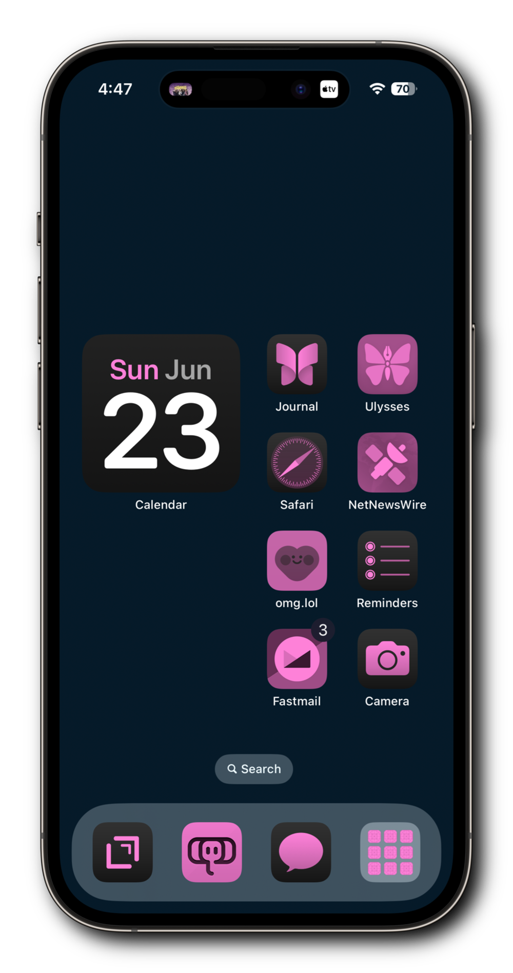 A smartphone home screen with a dark blue background and various app icons. The icons are predominantly in pink and include Calendar, Journal, Ulysses, Safari, NetNewsWire, omg.lol, Reminders, Fastmail, and Camera. 