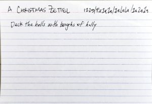 A 4x6" lined index card with the title: A Christmas Zettel. It has a Luhmannesque number identifier: 1225/Fa1a2a/1aLaLa/1a2a1a. The body of the note reads: Deck the halls with boughs of holly.