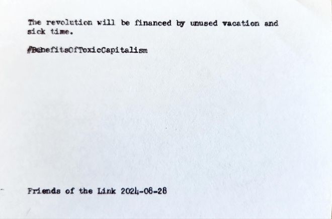 Typewritten index card that reads: The revolution will be financed by unused vacation and sick time. #BenefitsOfToxicCapitalism