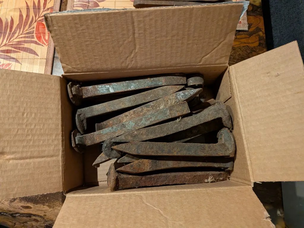 Open box of iron railroad ties