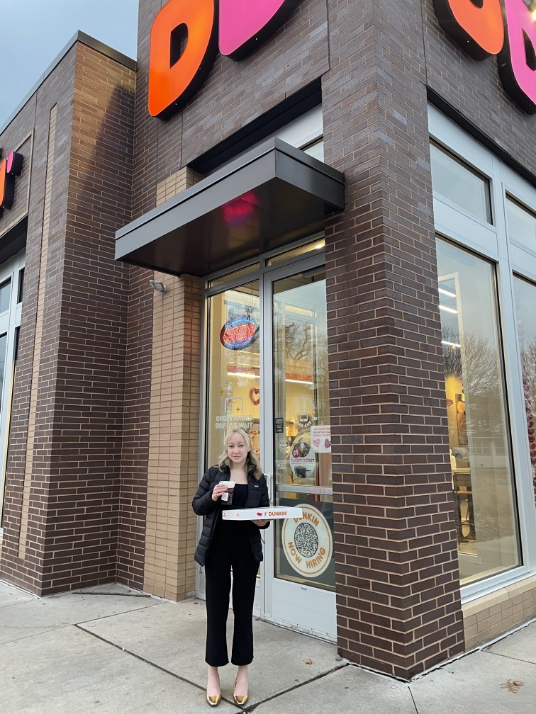 Beatrix outside with donuts