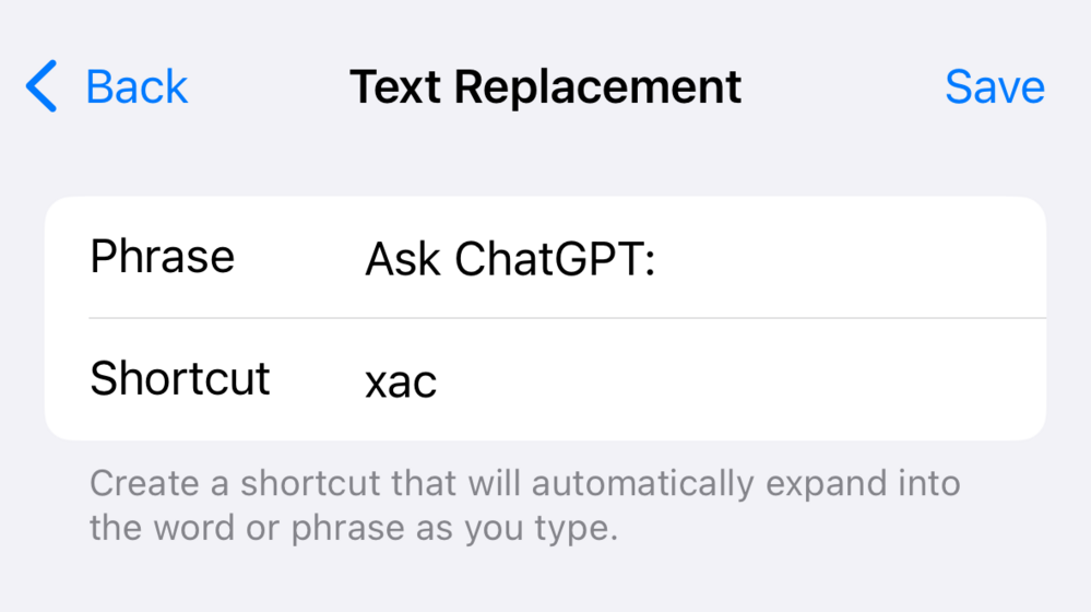 A text replacement screen shows: Phrase as “Ask ChatGPT:” and Shortcut as “xac,” indicating shortcut setup on a device. Options for “Back” and “Save” are visible at the top.