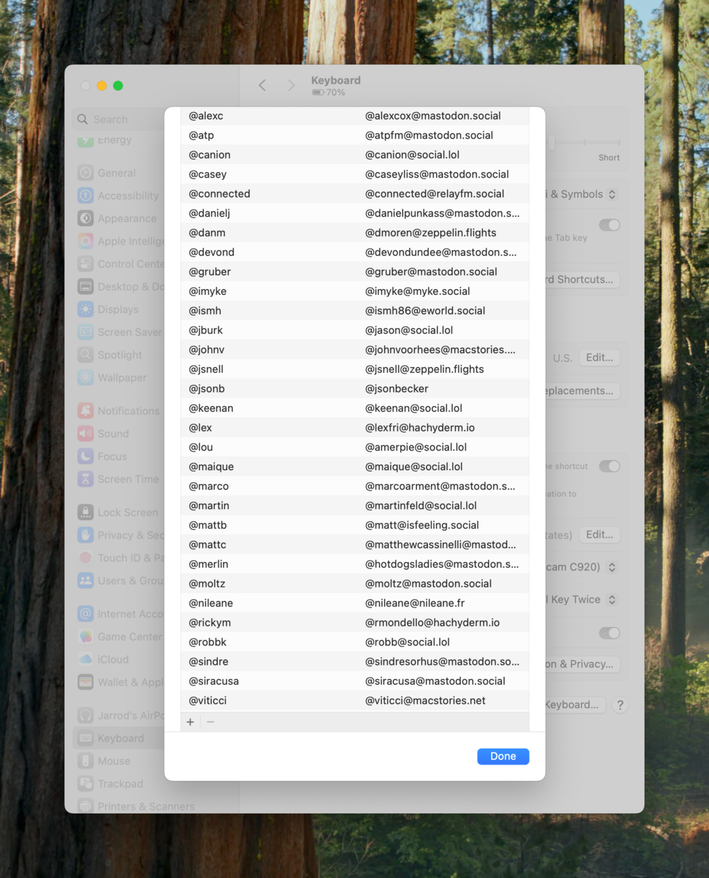 A pop-up window lists usernames and their mastodon addresses. The content is overlaid on a settings menu with options like “General” and “Keyboard” visible in a forest-themed background.
